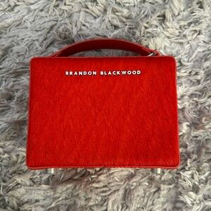 Mini Brandon Blackwood pony hair trunk in orange